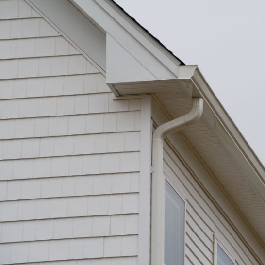 Front view of gutter on white residential home